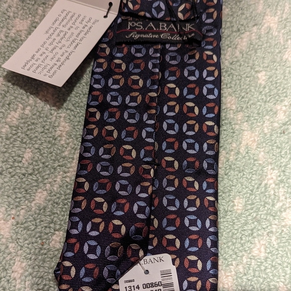 Jos. A. Bank signature collection navy tie with multi color geometric pattern. - Picture 4 of 4